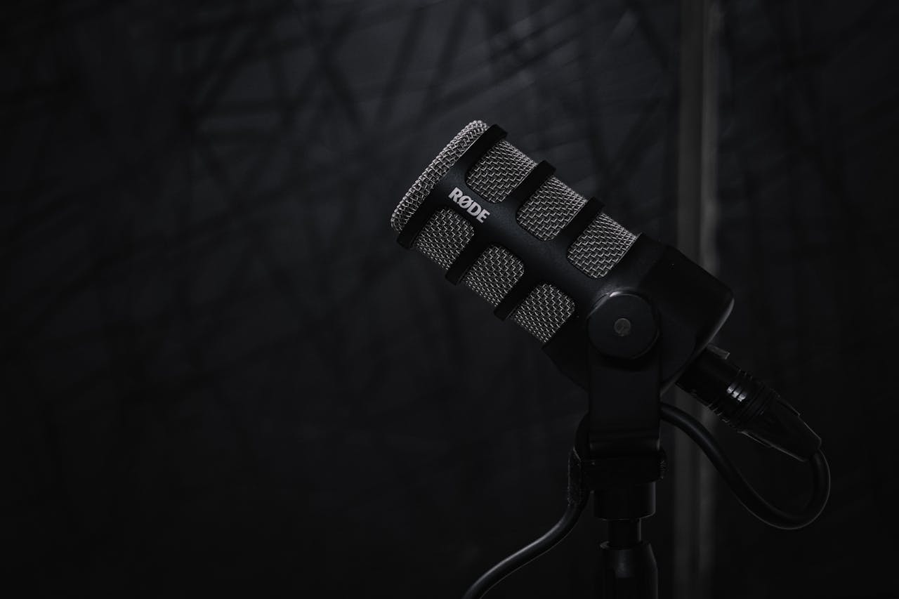 High-quality close-up of a Rode PodMic on a stand, perfect for podcast and audio recording setups.