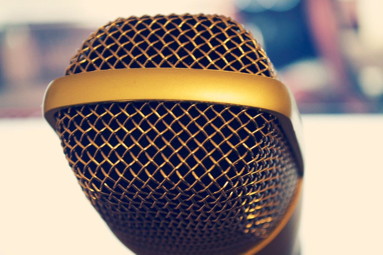 why-choose-us Elegant close-up of a gold microphone, perfect for audio and music themes.